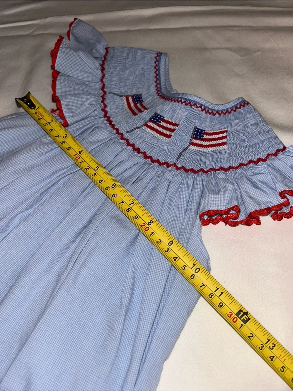 Girls' Light Blue Smocked Dress with Red Trim and Flag Embroidery